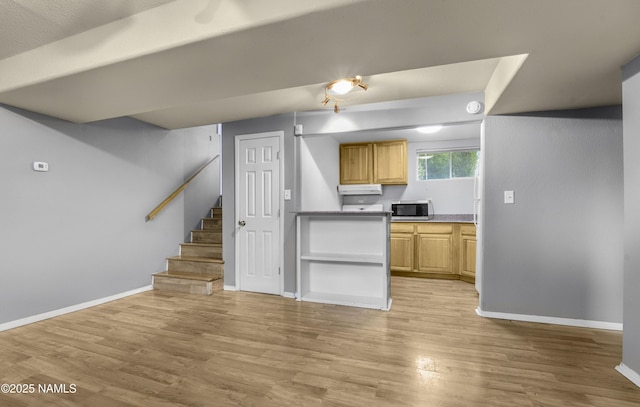 3580 N Jamison Blvd, Flagstaff, AZ 86004 - kitchen featuring stainless steel microwave, light wood finished floors, and light brown cabinetry