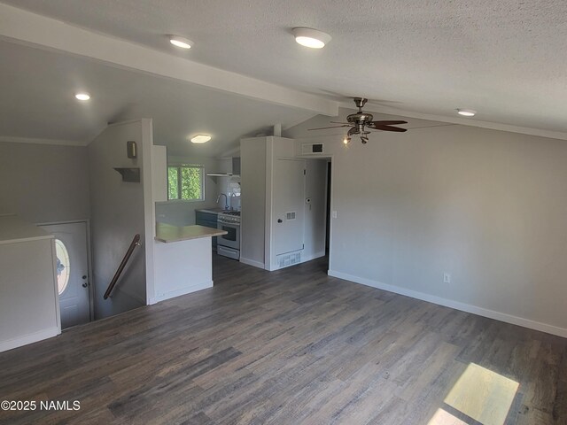 3580 N Jamison Blvd, Flagstaff, AZ 86004 - kitchen featuring ceiling fan, stainless steel gas stove, dark wood-type flooring, light countertops, and lofted ceiling