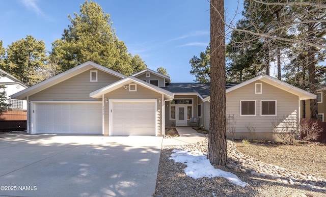 2476 S Cliffview St, Flagstaff, AZ 86001 - view of front of house with concrete driveway and an attached garage