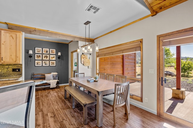 7507 Deville Ln, Flagstaff, AZ 86004 - dining room featuring wood finished floors, a chandelier, and crown molding
