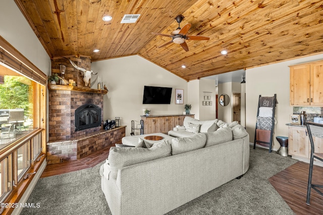 7507 Deville Ln, Flagstaff, AZ 86004 - living room featuring wood ceiling, ceiling fan, vaulted ceiling, a brick fireplace, and wood finished floors