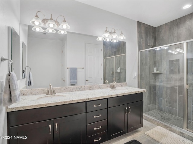 bathroom with vanity, walk in shower, and tile patterned floors