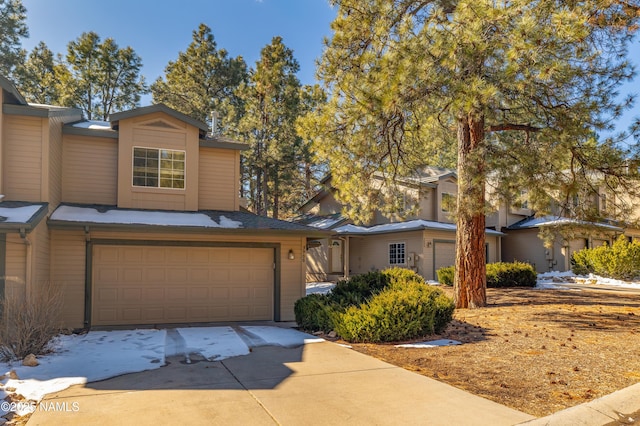 view of front of property featuring an attached garage and driveway