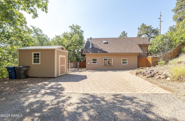1905 E Mountain View Ave, Flagstaff, AZ 86004 - back of property featuring a shed, a metal roof, and a patio area