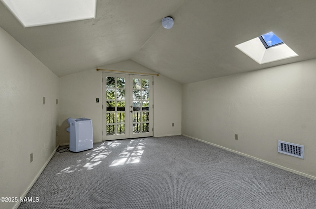 1905 E Mountain View Ave, Flagstaff, AZ 86004 - additional living space featuring a skylight, carpet flooring, lofted ceiling, and french doors