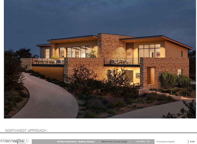 view of front of home with a balcony