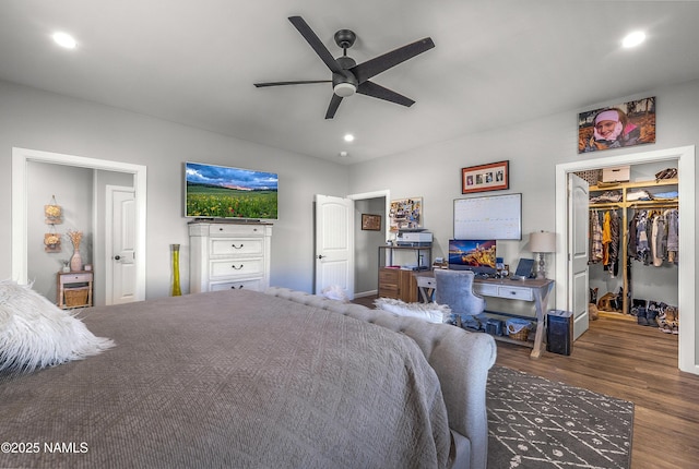 3095 E Pinetree Dr, Williams, AZ 86046 - bedroom featuring wood finished floors, a walk in closet, recessed lighting, a closet, and a ceiling fan