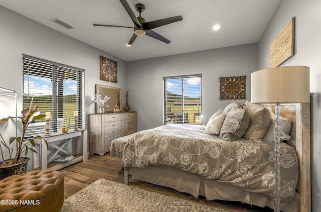 3095 E Pinetree Dr, Williams, AZ 86046 - bedroom with wood finished floors, multiple windows, ceiling fan, and recessed lighting