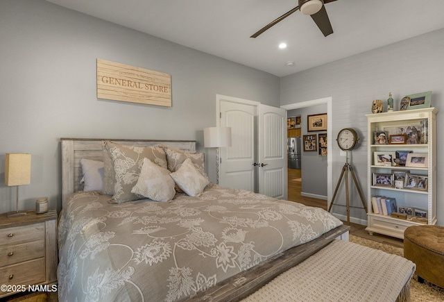 3095 E Pinetree Dr, Williams, AZ 86046 - bedroom with stainless steel fridge with ice dispenser, ceiling fan, and recessed lighting