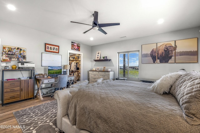 3095 E Pinetree Dr, Williams, AZ 86046 - bedroom featuring wood finished floors, a spacious closet, recessed lighting, a closet, and a ceiling fan