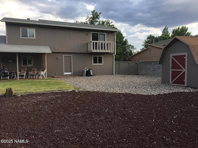 1908 N Deer Crossing Rd, Flagstaff, AZ 86004 - rear view of house with a storage shed, a balcony, and a patio area