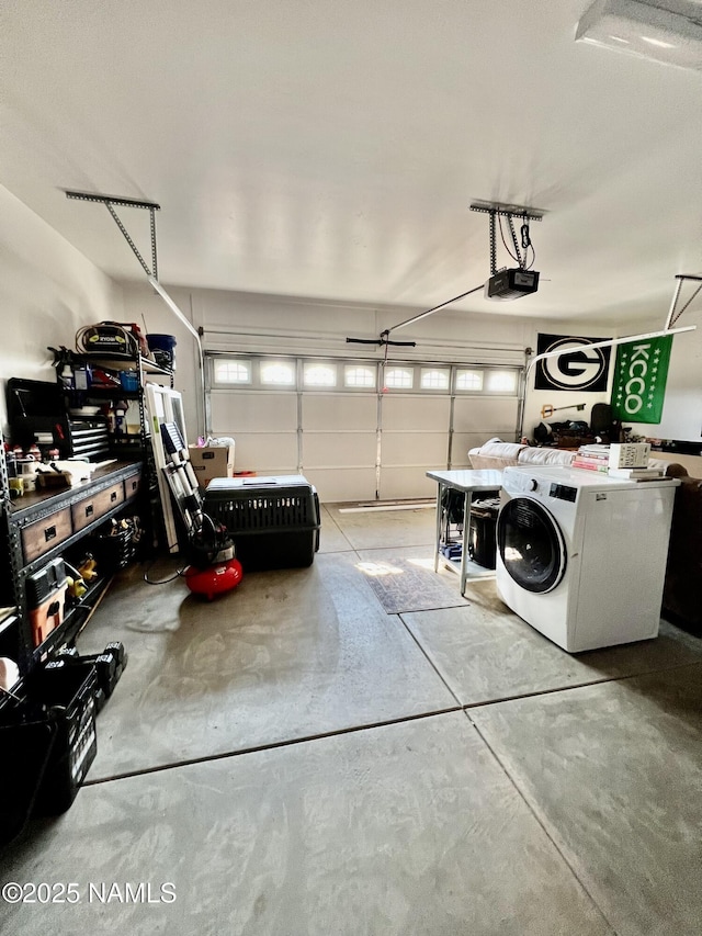 garage with a garage door opener and washer / clothes dryer