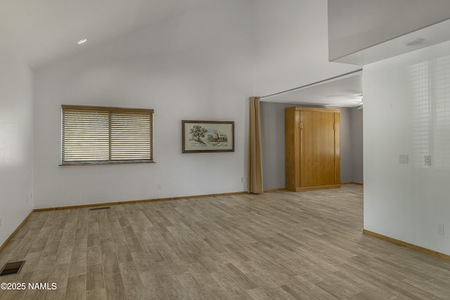 1470 W Melissa Dr, Flagstaff, AZ 86005 - empty room with high vaulted ceiling and light wood finished floors