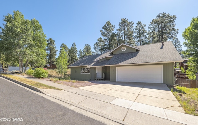 1470 W Melissa Dr, Flagstaff, AZ 86005 - ranch-style house with a garage, a shingled roof, and concrete driveway