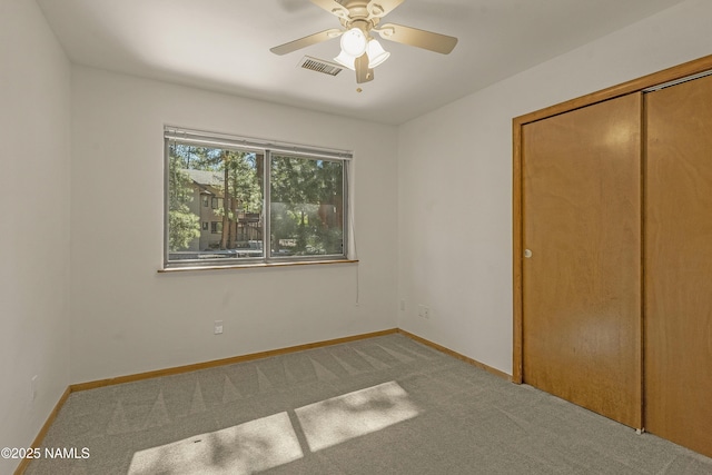 1470 W Melissa Dr, Flagstaff, AZ 86005 - unfurnished bedroom featuring carpet flooring, a closet, and a ceiling fan