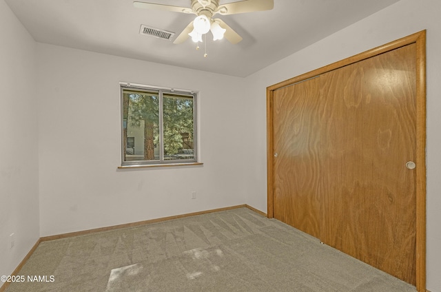 1470 W Melissa Dr, Flagstaff, AZ 86005 - unfurnished bedroom with carpet, a closet, and a ceiling fan