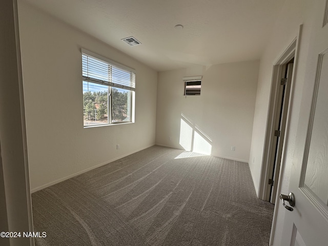 spare room featuring carpet floors