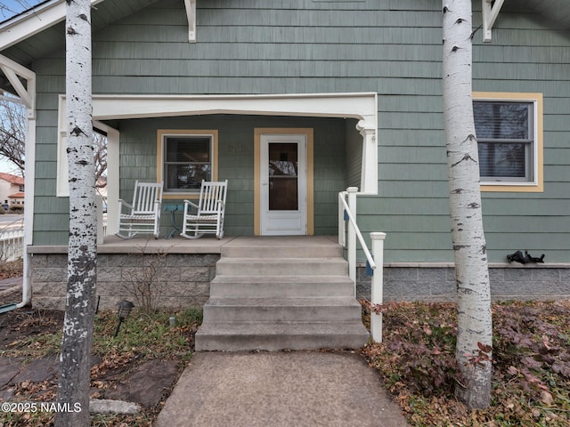 entrance to property featuring a porch