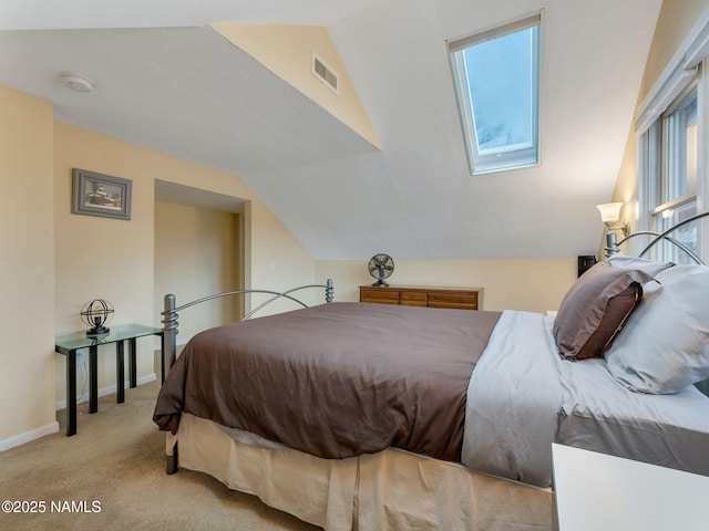 bedroom with visible vents, lofted ceiling, carpet, and baseboards