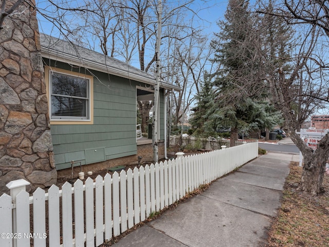 view of home's exterior featuring a fenced front yard