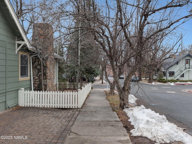 view of road with a residential view and sidewalks