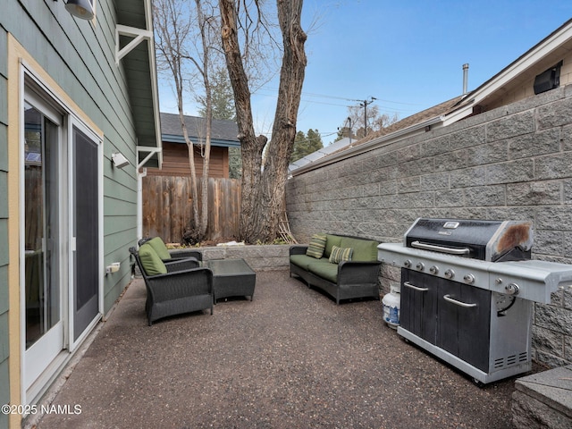 view of patio / terrace with a grill, an outdoor hangout area, and fence