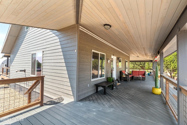 wooden terrace featuring an outdoor hangout area