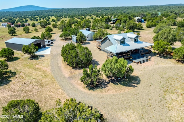 birds eye view of property featuring a mountain view