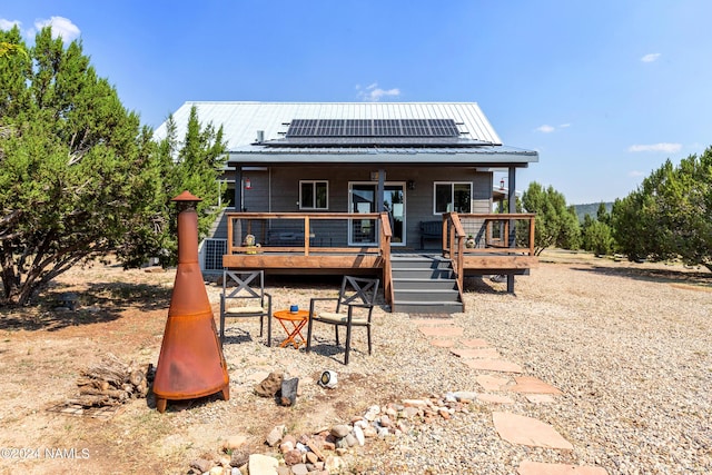 back of property with solar panels