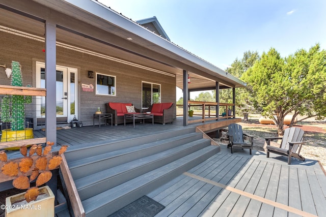 wooden terrace featuring outdoor lounge area