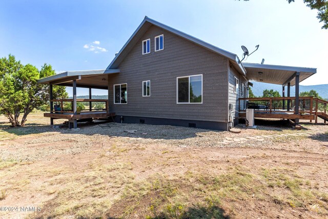 rear view of house with a deck