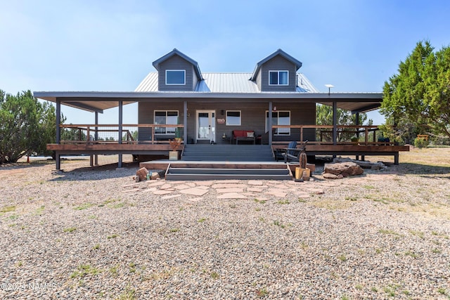 farmhouse inspired home with a deck