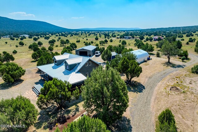 aerial view featuring a mountain view and a rural view