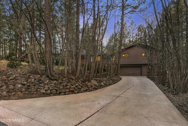 view of front of property with a garage and driveway