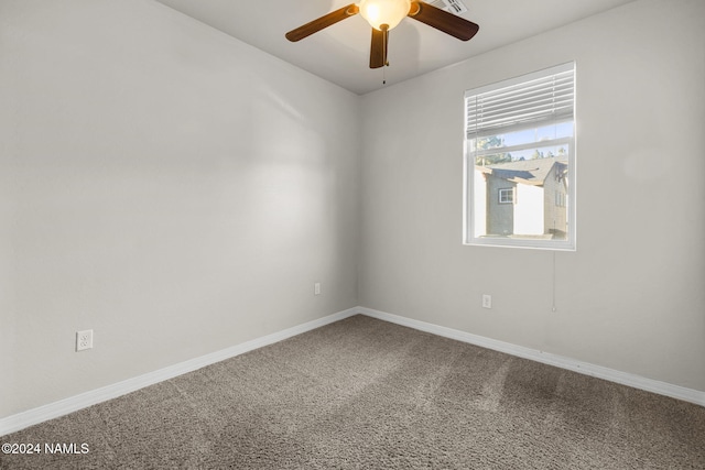 carpeted empty room featuring ceiling fan