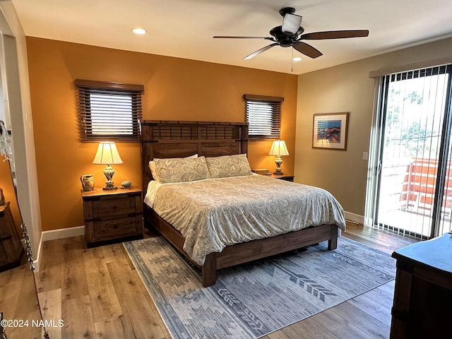 bedroom with ceiling fan, access to exterior, and light hardwood / wood-style flooring