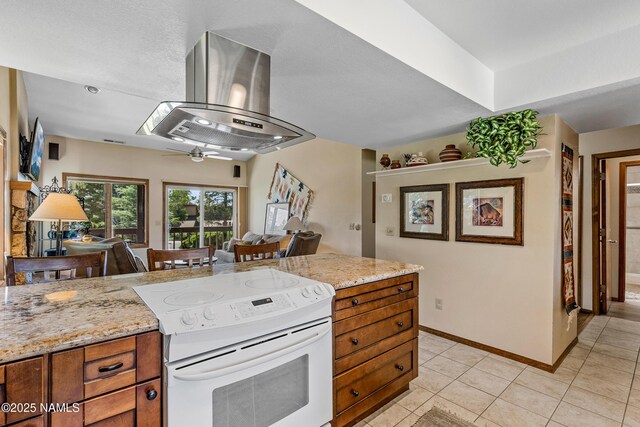 2303 N Plateau Dr, Flagstaff, AZ 86004 - kitchen featuring white range with electric stovetop, island range hood, ceiling fan, and brown cabinetry