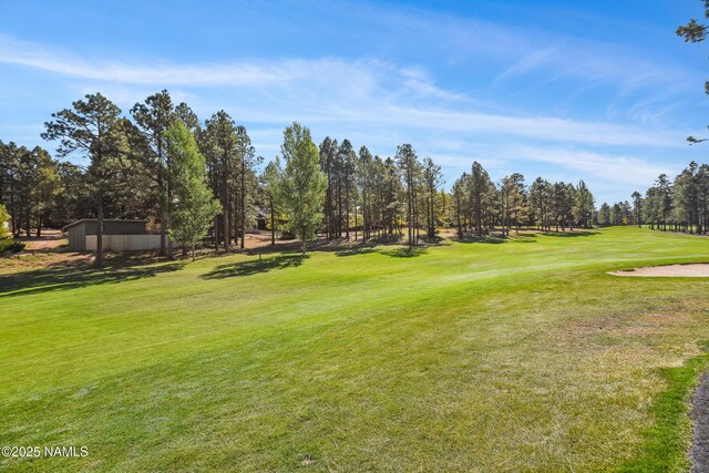 2303 N Plateau Dr, Flagstaff, AZ 86004 - view of community with a yard, view of wooded area, and view of golf course