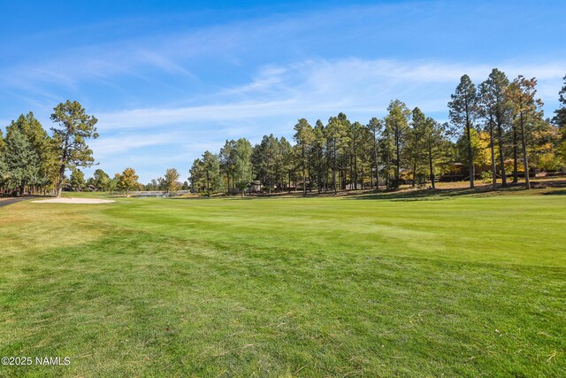 2303 N Plateau Dr, Flagstaff, AZ 86004 - surrounding community with a yard and view of golf course