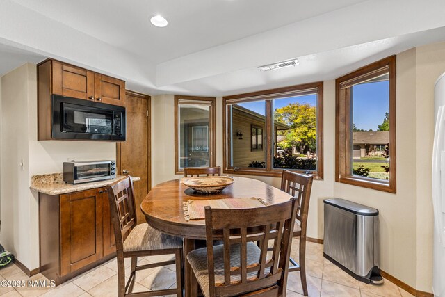 2303 N Plateau Dr, Flagstaff, AZ 86004 - dining room featuring baseboards and light tile patterned floors