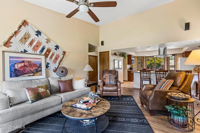 2303 N Plateau Dr, Flagstaff, AZ 86004 - living area featuring ceiling fan, wood finished floors, and a towering ceiling
