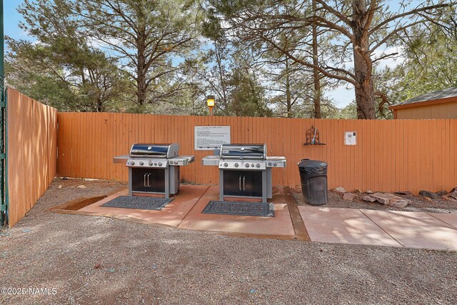 2303 N Plateau Dr, Flagstaff, AZ 86004 - fenced backyard with grilling area
