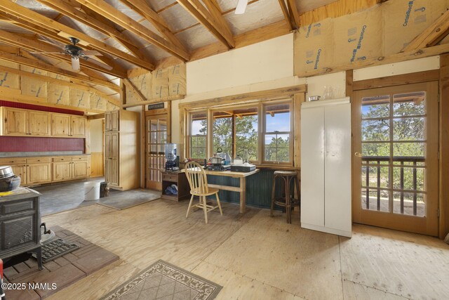 89 N Wyandotte Rd, Williams, AZ 86046 - office space with a wood stove, plenty of natural light, and a ceiling fan