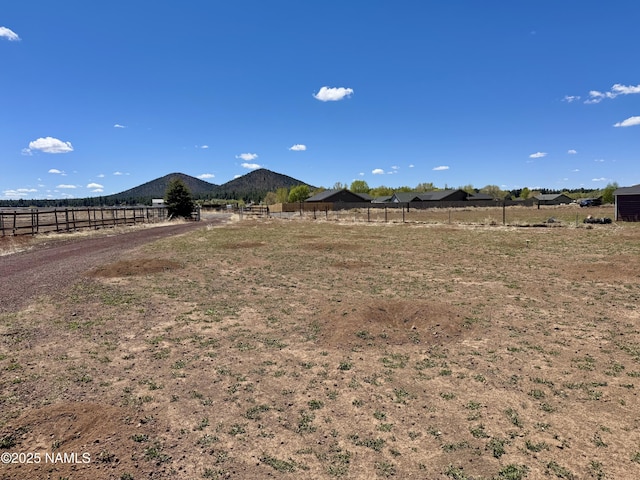 7840 Cowboy Way, Flagstaff, AZ 86004 - view of yard featuring fence and a mountain view