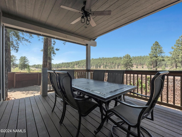 wooden deck featuring ceiling fan