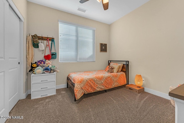 carpeted bedroom featuring a closet and ceiling fan