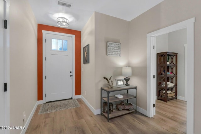 foyer with light wood-type flooring