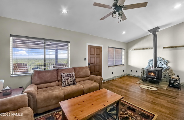1384 W Canvasback Trl, Williams, AZ 86046 - living room featuring a wood stove, a ceiling fan, wood finished floors, vaulted ceiling, and recessed lighting