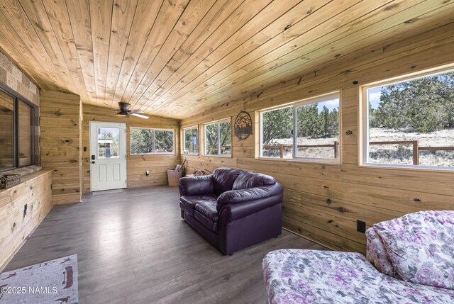 1384 W Canvasback Trl, Williams, AZ 86046 - living area featuring wood walls, vaulted ceiling, wooden ceiling, wood finished floors, and a ceiling fan