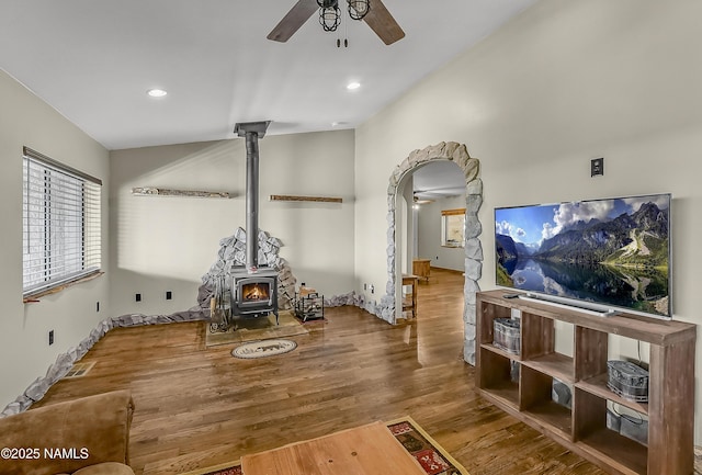 1384 W Canvasback Trl, Williams, AZ 86046 - living area with a ceiling fan, a wood stove, wood finished floors, recessed lighting, and arched walkways